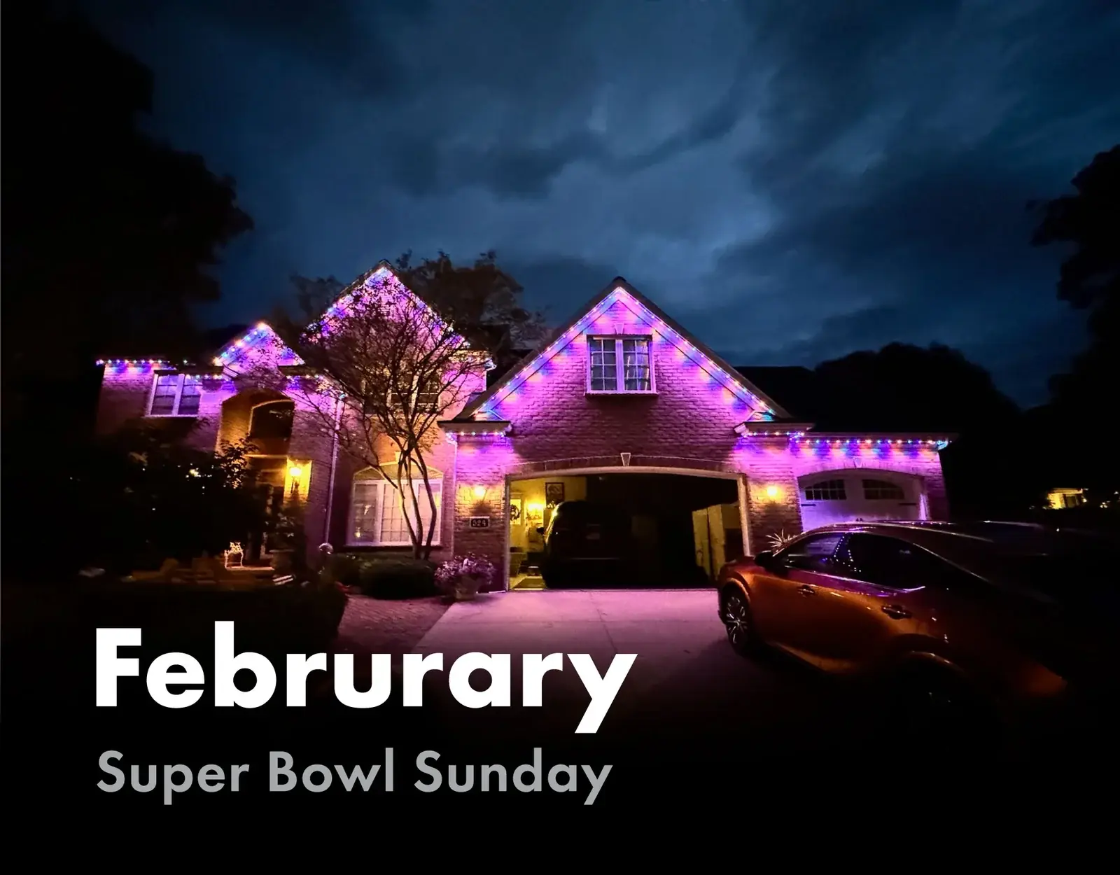 Home roofline lit in purple and blue for Super Bowl Sunday in February