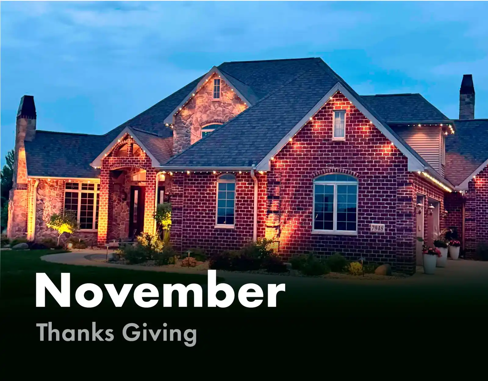 Brick home lit in warm amber for Thanksgiving in November