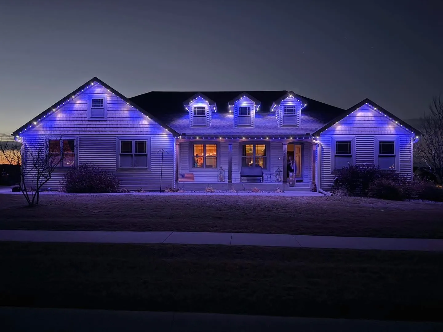 Blue roofline wash on a Capital Region ranch
