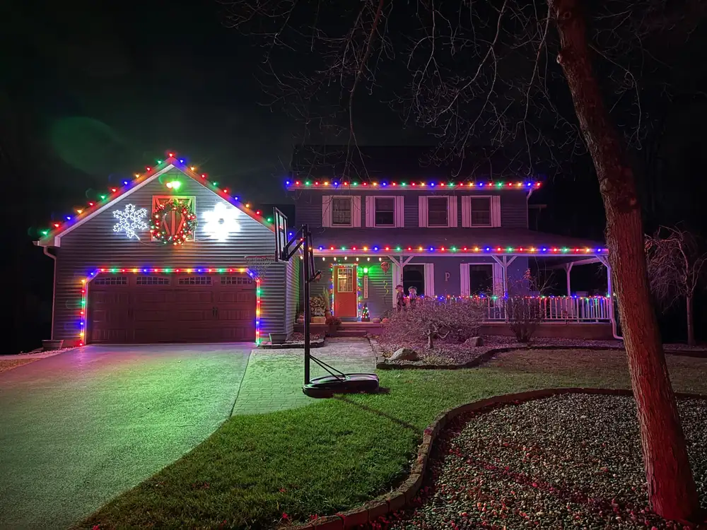Multi color C9 Christmas rooflines with garage outline and lit porch railings